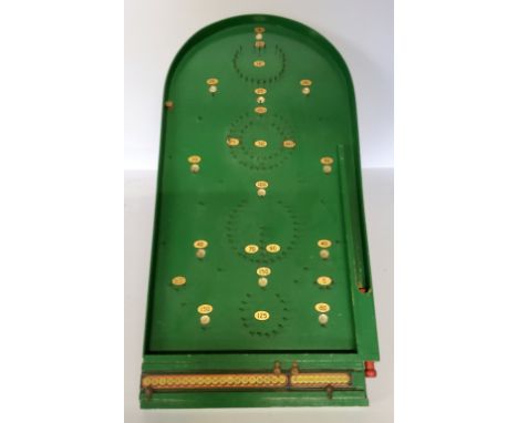 A Chad Valley bagatelle board with the original scoreboard and steel balls 