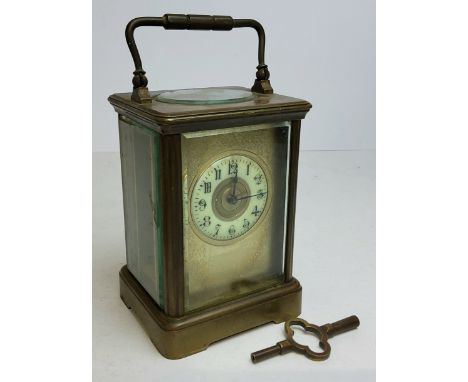 A 19th century French Corniche carriage clock, the backplate stamped with S&nbsp; F , cream enamel chapter ring, black Arabic