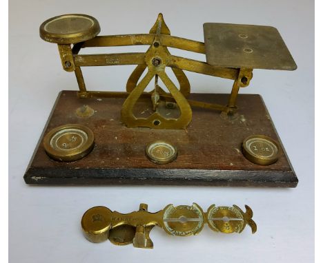 A set of 19th century HARRISON sovereign balance scales stamped with crown, Birmingham; a set of early 20th century postal sc