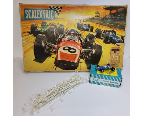 A Scalextric Grand Prix model motor racing set, No 75, includes fly over bridge and change overs 1 C9 Ferrari GP &amp; 1 C8 L