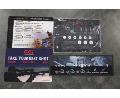 Four work bench mats, to include Federal, CCI, Sightmark and Nitesite.  The Federal mat measuring 29 x 41 cm.