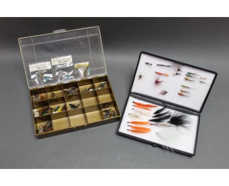 Two fly boxes, the first made by The House of Hardy Alnwick, the second containing Hardy sea trout flies.