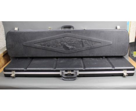 Two hard plastic shotgun or rifle cases, the first by Gunguard +/-132 cm and another 123 cm, both with foam lined interiors.