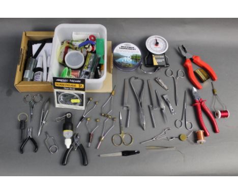 A large quantity of fly tying tools, to include bobbin holders etc.
