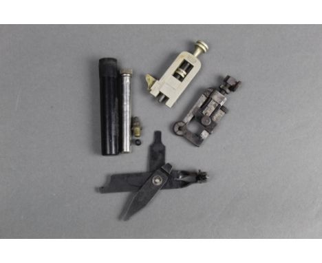 A Parkers improved vernier, together with another peep sight, an armourers tool with military broad arrow marked 1989 and two