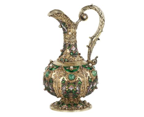 An extremely exquisite decorative pitcher in the historicist style made of silver, gilding and partly enamel, is a magnificen