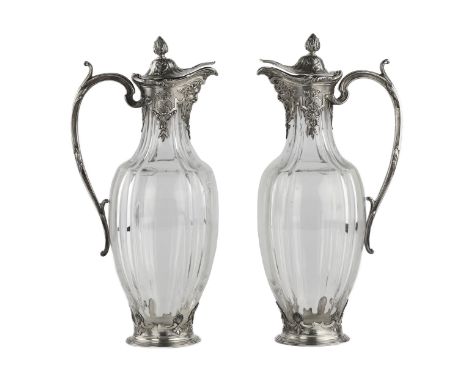 A pair of stately and graceful crystal wine jugs in silver from the CHRISTOFLE company. Made in Regency style. Elongated amph