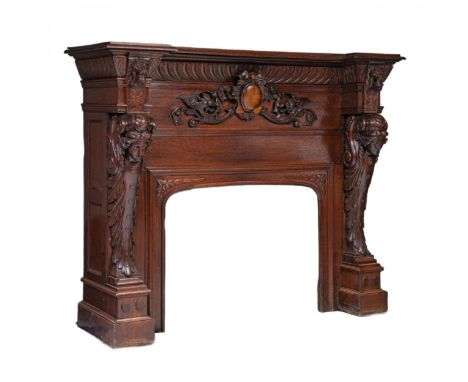 Carved oak fireplace with noble stained color and Renaissance architectural forms. With a bravura projection of the cornice, 