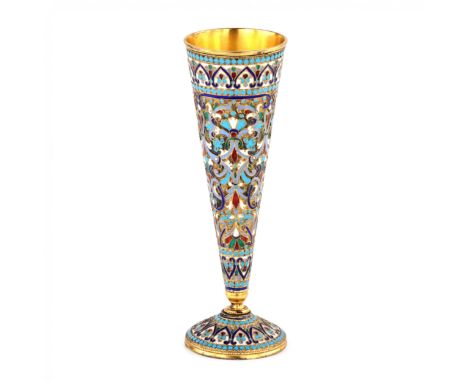 Luxurious tableware. Gilded silver champagne glass in cloisonne enamel. Simple but recognizable conical shape, completely cov