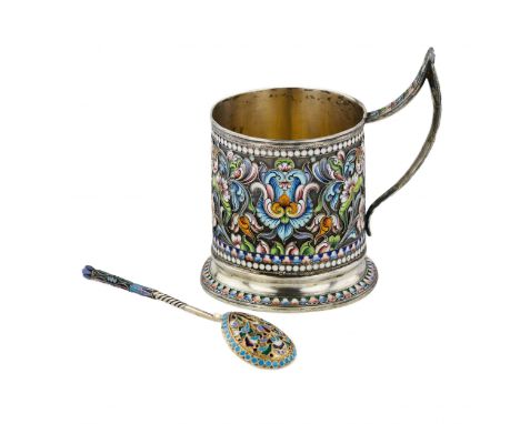 Silver glass holder with a spoon decorated with cloisonne enamel. Cylindrical glass holder with a high curved sharp-angled ha