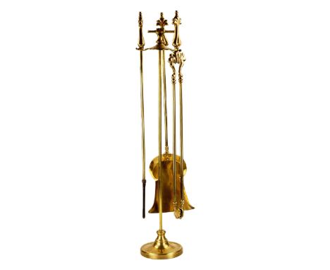 Fine, gilded bronze fireplace set in Louis XV style. 19th century. On a round stand with handle, includes tongs, shovel and p