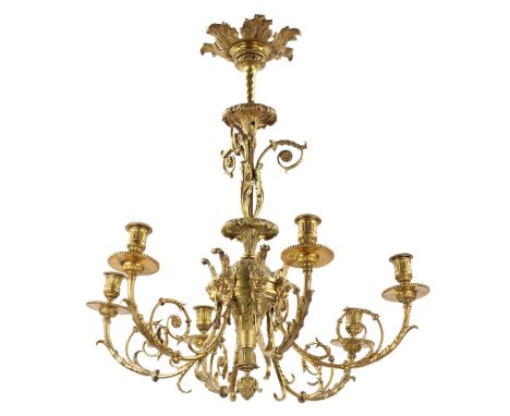 Bronze, gilded chandelier in the style of Louis XVI, maintains an elegant balance of whimsical curls and clarity of design. V