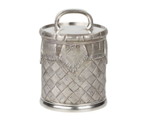 Silver caviar jar made in the form of a rustic basket with a lid, imitating relief weaving of bast. The jar is decorated with