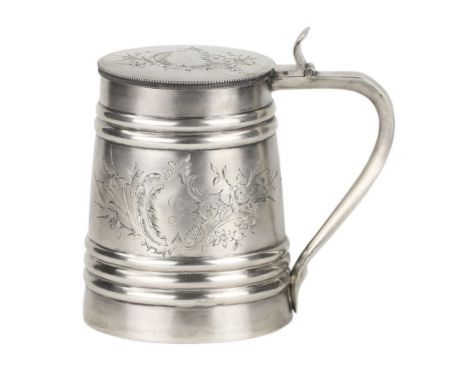 Silver mug with lid, made at the turn of the 19th and 20th centuries, decorated with an engraving pattern in the form of a fl