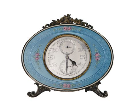 Round and weighty 8-day alarm clock, Vacheron Constantin, in an oval silver frame on an easel support, and decorated with flo