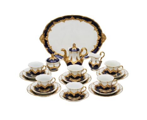Meissen B Form. Gold and cobalt tea and coffee service for six persons. Includes coffee pot, creamer, sugar bowl, tray, 6 cup