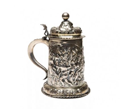 Massive silver beer goblet with battle scenes. Made in the spirit of pompous Baroque with a dynamic relief of a medieval batt