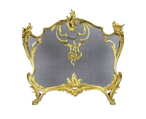 Bouhon. Fireplace screen in gilded bronze with metal protective mesh, Louis XV style. A magnificent example of a mixture of s