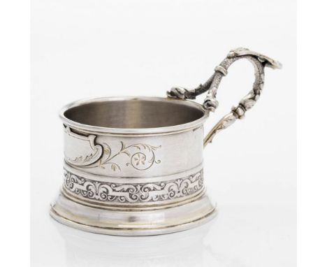 Silver glass holder with openwork handle and plant decoration, late 19th century Made in: Helsinki, 1884 Maker: Hjalmar Fager