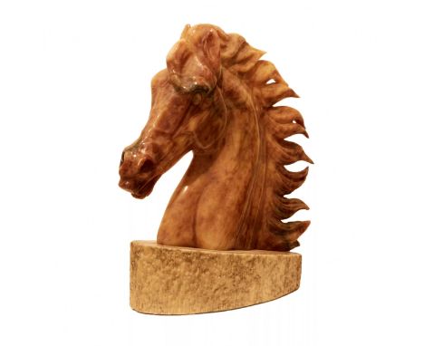 Horse head on a pedestal. A heroic portrait of a horse, with a proudly arched neck, a developing mane and open nostrils. Like