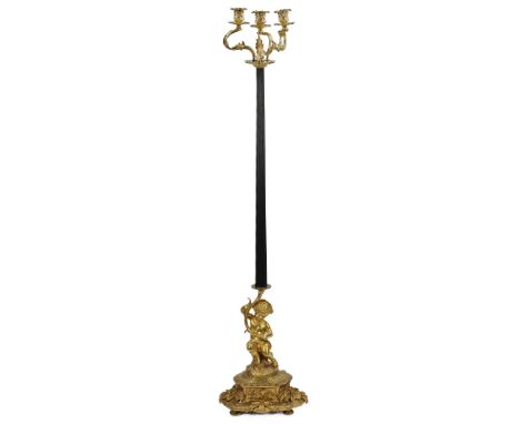 French gilded and patinated bronze floor lamp, with putti at the base and three gilded candlesticks. End of the 19th century.