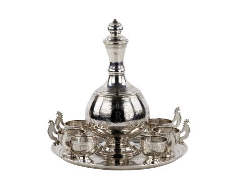 Elegant vodka set in neo-Russian style made of silver, with a decanter and six feet on a tray. The original motif of carved c