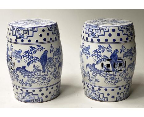CHINESE STOOLS, a pair, Chinese blue and white ceramic of pierced drum form, 45cm H. (2) 
