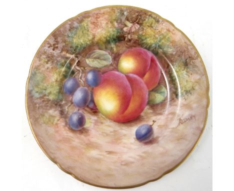 A Royal Worcester side plate, decorated with hand painted fruit, by Freeman, to a shaped gilded edge, circa 1954, diameter 6.