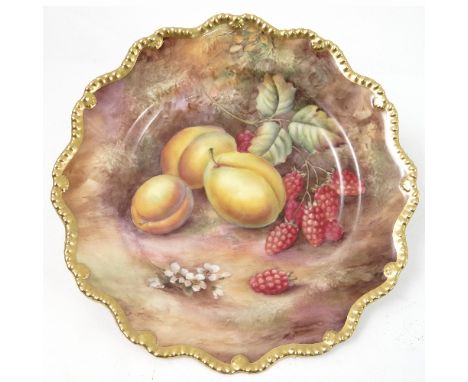 A Royal Worcester cabinet plate, decorated with hand painted fruit, by Price, to a shaped gilded gadrooned border, circa 1950