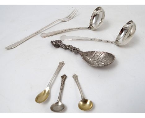 A pair of small ladles, with trefid end, Birmingham 1915, weight 1oz, together with a Victorian silver caddy spoon, with leaf