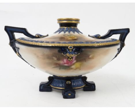 A Hadley's Worcester boat shaped centrepiece, decorated with flowers to a blue ground, width 7.5ins