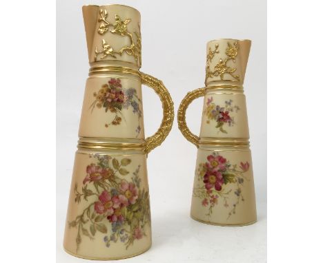 A pair of Royal Worcester blush ivory claret jugs, decorated with flowers, shape number 1047, circa 1911, height 10.25ins