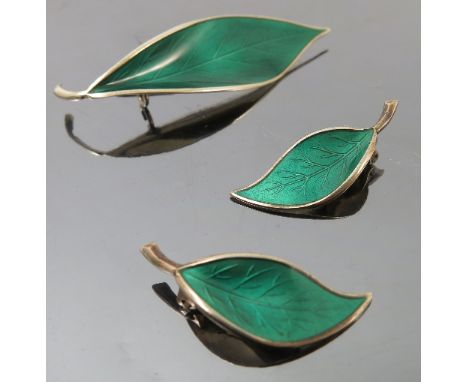 A David Andersen silver and enamel brooch, together with a pair of matching ear clips, formed as leaves with green enamel, st