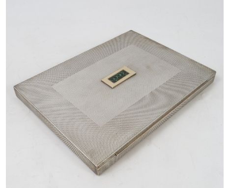 A German silver cigarette box, of rectangular form, with engine turned decoration, the top set with ten square cut green ston