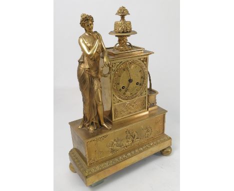 A 19th century French gilt metal mantel clock, the striking movement with gilt dial and wreath frame, set in a rectangular ca