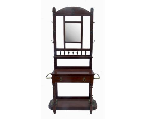 A mahogany hall stand, with mirror back, cloak hooks, drawer and stick stand to either side, width 30ins 