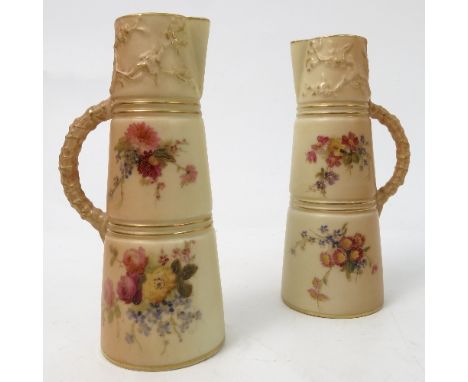 A pair of Royal Worcester blush ivory claret jugs, decorated with flowers, shape number 1047, circa 1907 and 1911, height 5in