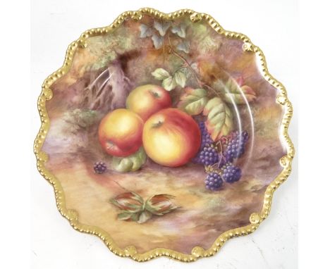 A Royal Worcester cabinet plate, decorated with hand painted fruit, by Price, to a shaped gilded gadrooned border, circa 1950