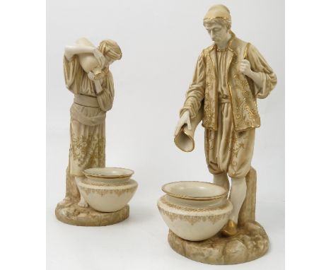 A pair of Royal Worcester figures, of eastern water carriers, shape no. 594, dated 1912, one restored, height 11.5ins and 12.