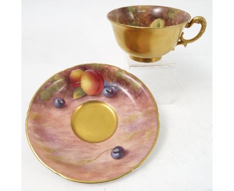 A Royal Worcester cabinet teacup and saucer, decorated to the saucer by Maybury and to the interior of the cup by Cox, with h