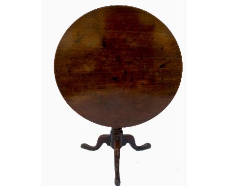 A Georgian mahogany revolving tilt top table, raised on tripod base, diameter 35.5ins