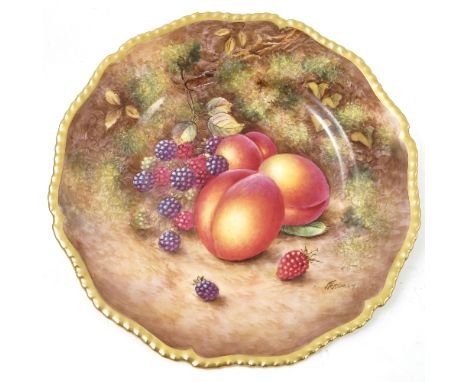 A Royal Worcester cabinet plate, decorated with hand painted fruit, by Freeman, to a shaped gilded gadrooned edge, diameter 1