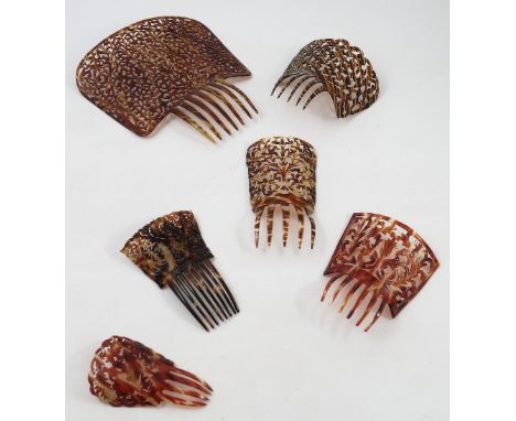 A 19th century tortoiseshell hair comb, with pierced scrolling leaf decoration, together with five other faux tortoiseshell h