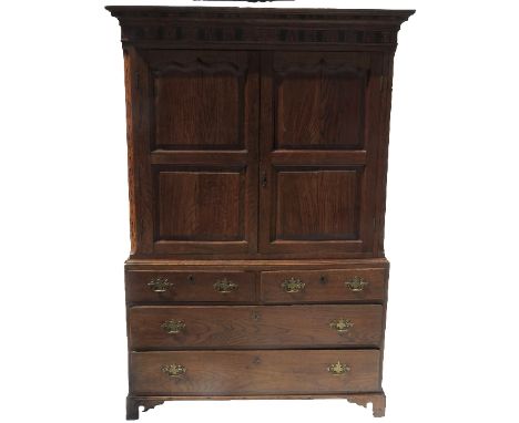 An Antique oak press cupboard, with twin fielded panelled doors, with Tunbridge and other inlay to the doors, fitted two shor