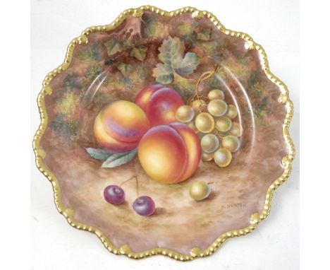 A Royal Worcester cabinet plate, decorated with hand painted fruit, by Ayrton, to a shaped gilded gadrooned border, diameter 