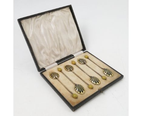 A cased set of six silver and enamel coffee bean spoons, the backs of the bowls decorated in yellow and black, Birmingham 192