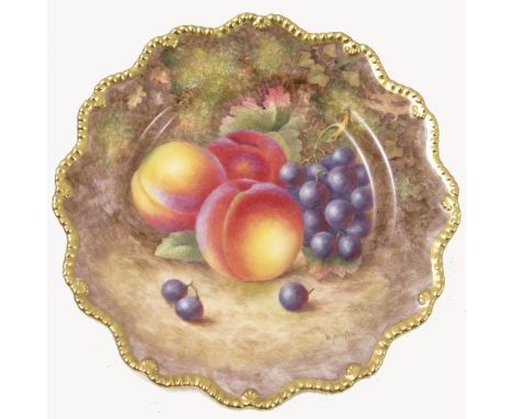 A Royal Worcester cabinet plate, decorated with hand painted fruit, by Ayrton, to a shaped gilded gadrooned border, circa 195