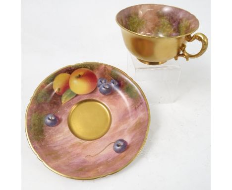 A Royal Worcester cabinet teacup and saucer, decorated to the saucer and to the interior of the cup by Maybury, with hand pai