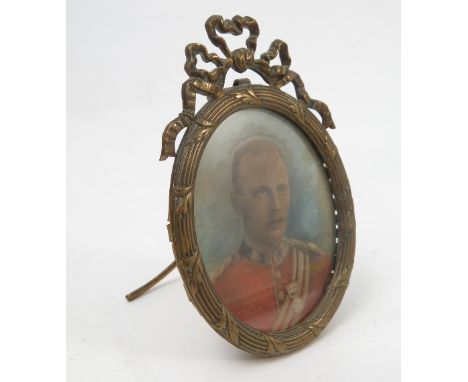 A 19th century oval watercolour portrait miniature, of a man in uniform, maximum diameter 2.75ins, in a gilt metal frame with