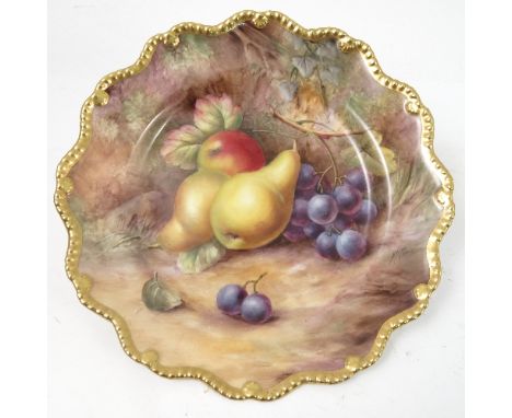 A Royal Worcester cabinet plate, decorated with hand painted fruit, by Price, to a shaped gilded gadrooned border, diameter 8
